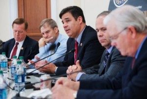 Freedom Caucus members including founding members, Rep. Jim Jordan, second from left, and Rep. Raul Labrador, center (Photo Credit: Roll Call)